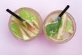 Two glasses with homemade iced tea with pieces of peaches. Summer refreshing drink, top view Royalty Free Stock Photo