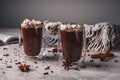 Two glasses of hot cocoa with marshmallows and chocolate chips on a background of scattered cloves, chocolate, star anise and Royalty Free Stock Photo