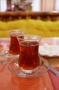 Two Glasses of Hot Turkish Tea and a Plate of Sugar Cubes with Selective Focus Royalty Free Stock Photo