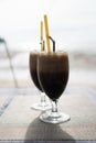Two glasses of ice coffee with milk with straws Royalty Free Stock Photo