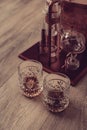 Two glasses with ice and whiskey on wooden background Royalty Free Stock Photo
