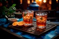 Two glasses of iced tea on a carved wooden coaster