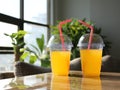 Two Glasses of juice glass on table blurry background shoot concept