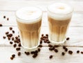 Two glasses of latte coffee and coffee beans Royalty Free Stock Photo