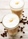 Two glasses of latte coffee and coffee beans Royalty Free Stock Photo