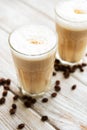 Two glasses of latte coffee and coffee beans Royalty Free Stock Photo