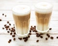 Two glasses of latte coffee and coffee beans Royalty Free Stock Photo