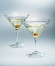 Two glasses martini with olive. cocktail isolated.