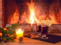 Two glasses with mulled wine, a candle, fir branches with decorations on a wooden table against the background of a Royalty Free Stock Photo