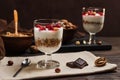 Two glasses of musli with yorurt and raspberries and nuts