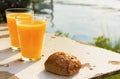 Two glasses of orange juice and bread Royalty Free Stock Photo