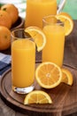 Two glasses of orange juice with sliced oranges Royalty Free Stock Photo