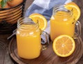 Two glasses of orange juice with orange slices Royalty Free Stock Photo