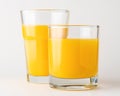 Two glasses of orange juice on white background. Fruit concept Royalty Free Stock Photo