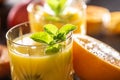 Two glasses with orange or multivitamin juice with mit herbs Royalty Free Stock Photo