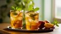 Two glasses of peach iced tea with mint leaves on wooden table. Generative AI Royalty Free Stock Photo