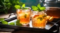 Two glasses of peach iced tea with mint leaves on wooden table. Generative AI Royalty Free Stock Photo