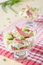 Two glasses of pink radish salad with cabbage