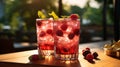 Two glasses with raspberries and ice on wooden table at summer garden Royalty Free Stock Photo