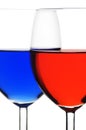 Two glasses of red and blue liquid Royalty Free Stock Photo
