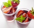 Two glasses of red fruit juice with strawberry Royalty Free Stock Photo