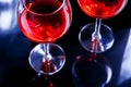 Two Glasses of red wine in bar, night club on black background Royalty Free Stock Photo