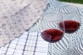 Two glasses with red wine on a beautiful tablecloth. Top view of alcoholic drink Royalty Free Stock Photo