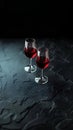 Two glasses of red wine on a black background. Royalty Free Stock Photo