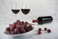 Two glasses of red wine with bottle and grapes. Royalty Free Stock Photo