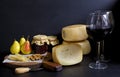 Two glasses of red wine and cheese pecorino, pears jam. Parmesan Royalty Free Stock Photo