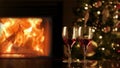 Two glasses of red wine by fireplace. Cozy romantic evening near the fireplace