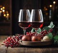 Two glasses of red wine, grapes, ball against a background of festive golden bokeh. Celebration of anniversary, holidays Royalty Free Stock Photo
