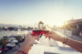 Two glasses with red wine in human hands against the background Royalty Free Stock Photo