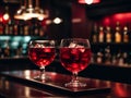 Two glasses of red wine with ice on bar counter Royalty Free Stock Photo