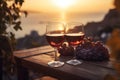 Two glasses of red wine in a restaurant overlooking beautiful mediterranean landscape on sunset. Generative AI