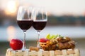 Two glasses of red wine at sunset Royalty Free Stock Photo