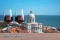 Two glasses of red wine on view of church of Santa Engracia National Pantheon in Lisbon, Portugal Royalty Free Stock Photo