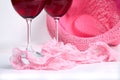 Two glasses of red wine on a white background near pink panties Royalty Free Stock Photo