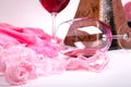 Two glasses of red wine on a white background of about pink pant Royalty Free Stock Photo