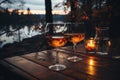 Two glasses of red wine on wooden table of outdoor restaurant on a background of scandinavian landscape. Drinking wine in outdoor Royalty Free Stock Photo