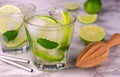 Two glasses of refreshing mojito on a marble background. Close-up.