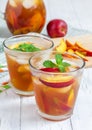Two glasses of refreshing peach iced tea Royalty Free Stock Photo