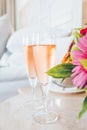 Two glasses of rose champagne in the upscale hotel room. Dating, romance, honeymoon, valentine, getaway concepts Royalty Free Stock Photo