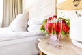 Two glasses of rose champagne in the upscale hotel room. Dating, romance, honeymoon, valentine, getaway, staycation Royalty Free Stock Photo