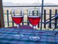 Two glasses of Sicilian red wine on the table covered with checkered tablecloth Royalty Free Stock Photo