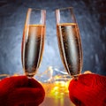 Two glasses with sparkling champagne wine in hands Royalty Free Stock Photo