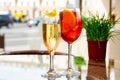 Two glasses of sparkling wine cocktails and Aperol Spritz cocktails on table in terrace of restaurant or summer cafe Royalty Free Stock Photo