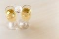 Two glasses of sparkling wine and coconut chip candy on top Royalty Free Stock Photo