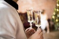 Two glasses with sparkling wine in male hands Royalty Free Stock Photo