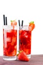 Two glasses of strawberry cocktail with ice and strawberry on top Royalty Free Stock Photo